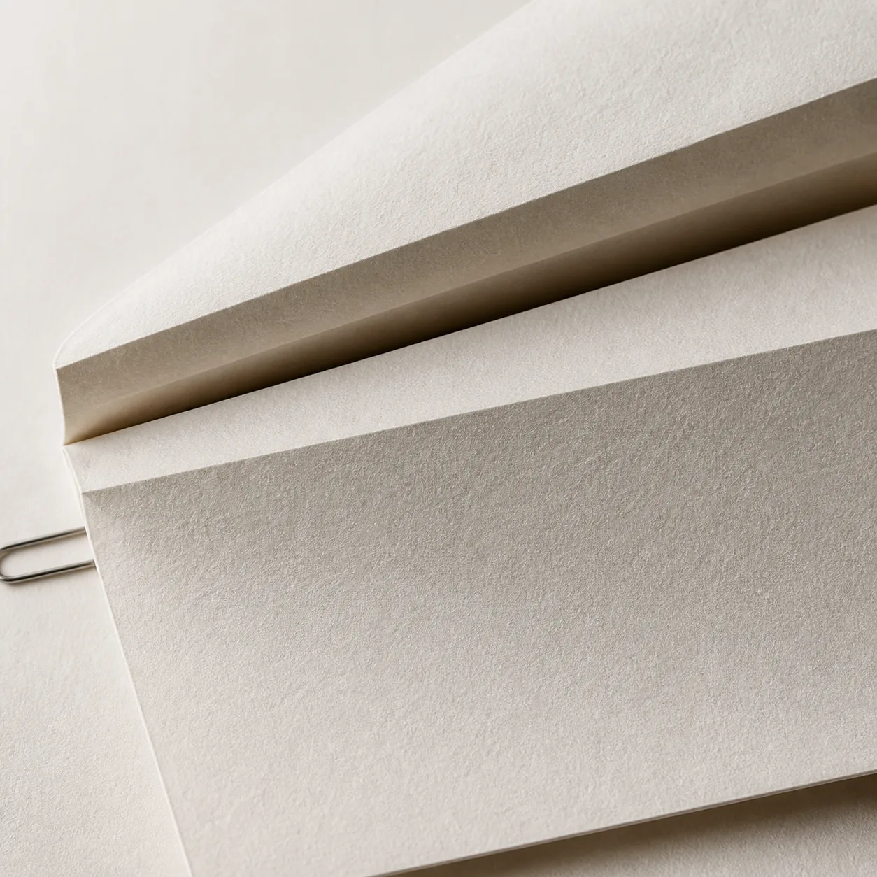 Layered paper folds showing evidence entering the system and useful context coming back out.