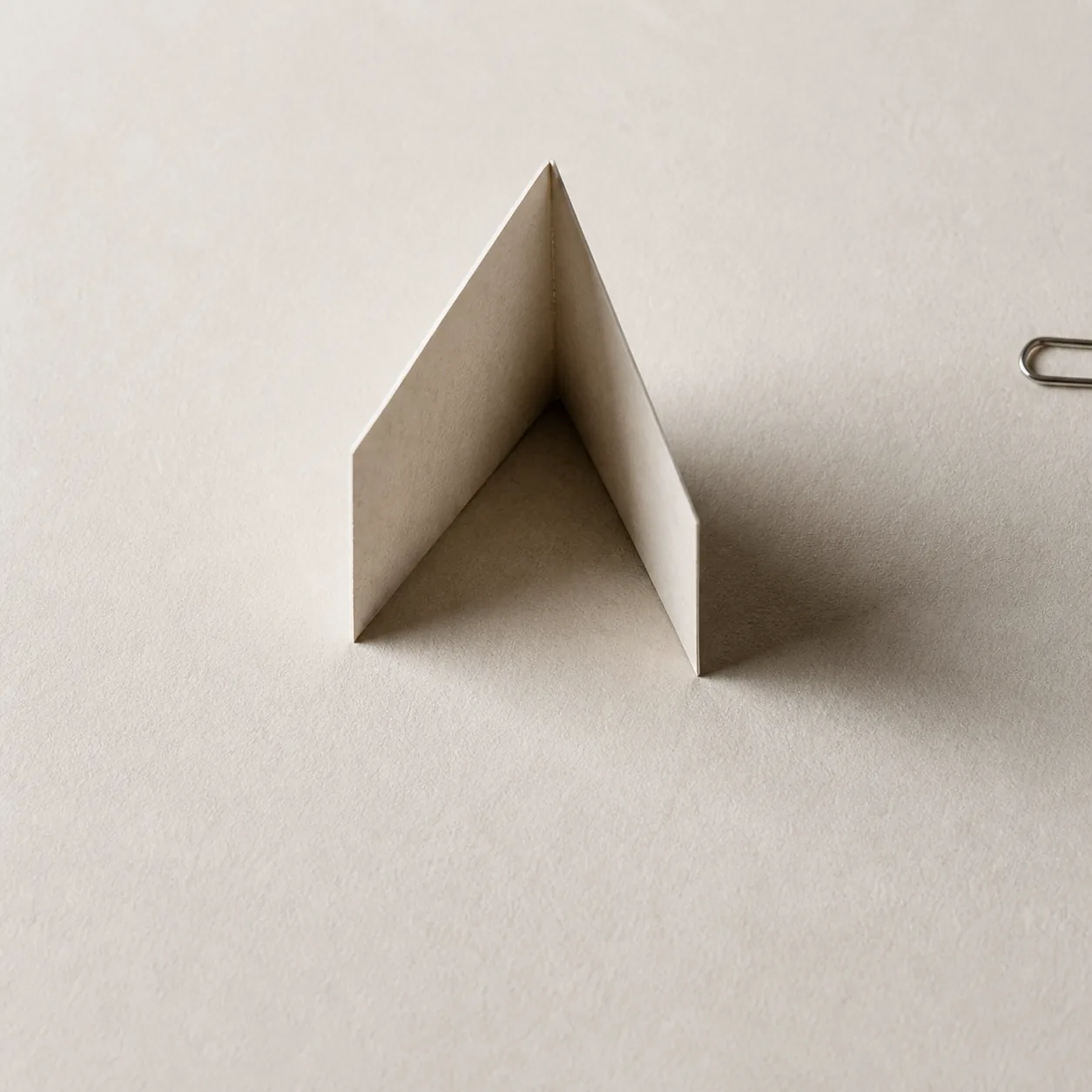 A paper fold ending without a return path, representing work that does not learn.